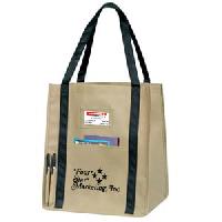 Recyclable Identity Shopper Tote Bags - CLOSEOUT! Recyclable Lightweight Non-Woven Material. Size: 13 x 15 x 10. Great convention bags and great shopping bags all in one! Reuse, Reduce, Recycle with this tear resistant water repellent tote containing recycled materials. Features front pocket, eco identity business card pocket, exterior pen compartments, and covered bottom support board.
