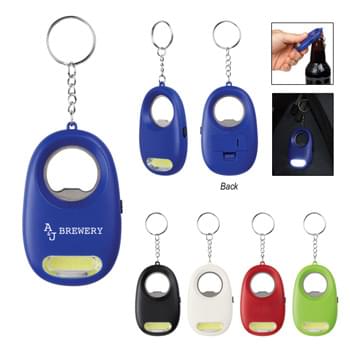 COB Light Key Chain With Bottle Opener - CLOSEOUT! Please call to confirm inventory available prior to placing your order!<br />Extra Bright White COB Light | Push Button To Turn Light On/Off | Split Ring Attachment | Button Cell Batteries Included