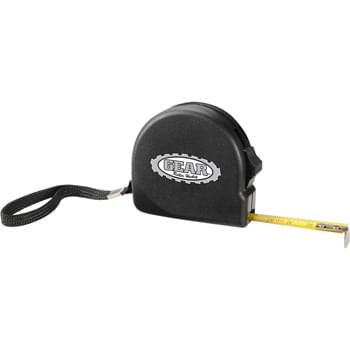 The Handyman Locking Tape Measure - 10-foot retractable tape measure. Standard and metric measurements. Woven nylon wrist strap. Slide-locking button locks tape in place. Metal belt-clip on back.